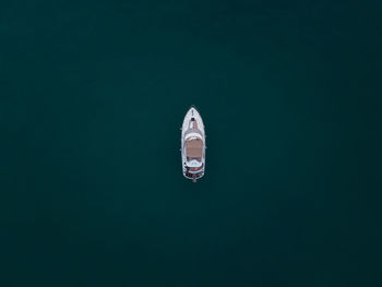 Aerial view of yacht moored in lake