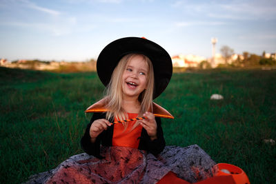 Portrait of smiling girl on field