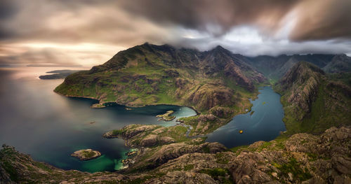 Scenic view of lake and mountains against sky