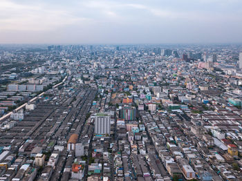 High angle view of city buildings against sky