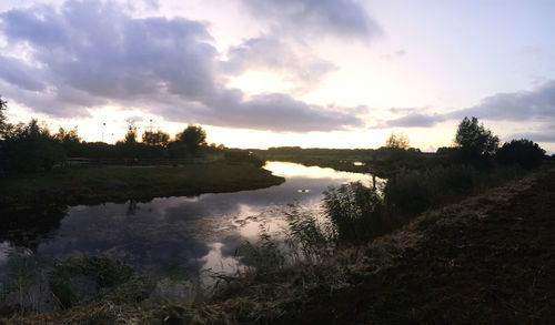 Scenic view of lake against sky during sunset