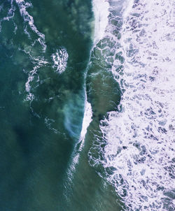 High angle view of water flowing in sea