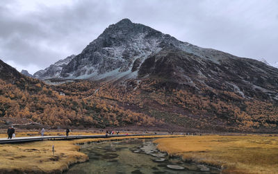 Scenic view of snow mountains against sky