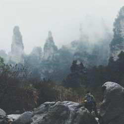 Scenic view of mountain against cloudy sky