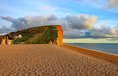 Scenic view of beach against sky