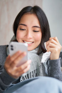 Young woman using mobile phone