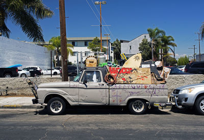 Cars on road against buildings in city