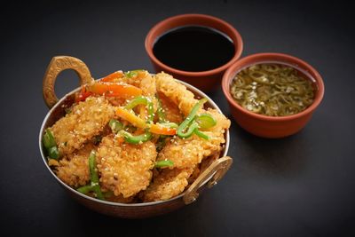 High angle view of food on table against black background