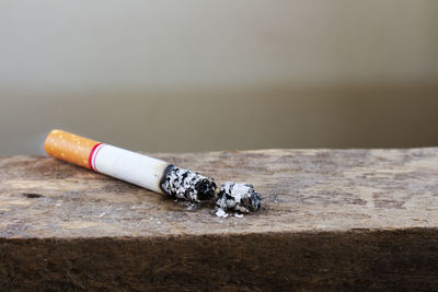 Close up of cigarette on wooden table