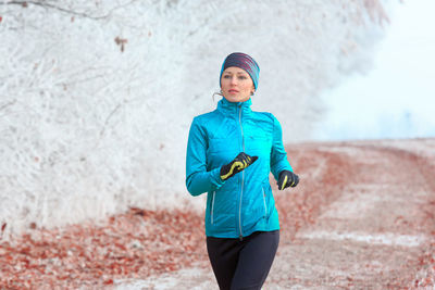 Beautiful woman running on land