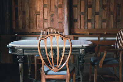 High angle view of empty chairs and table in cafe