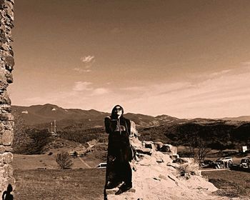 Woman standing on mountain landscape