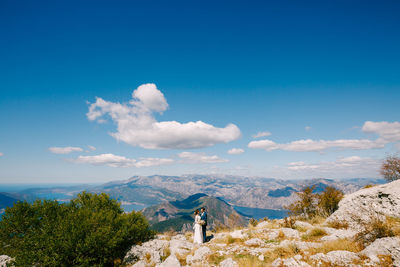 Scenic view of landscape against blue sky