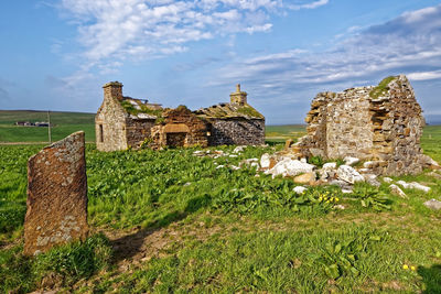 Old ruins of building against sky