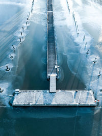 High angle view of pier on sea during winter