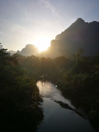 Scenic view of river against sky during sunset