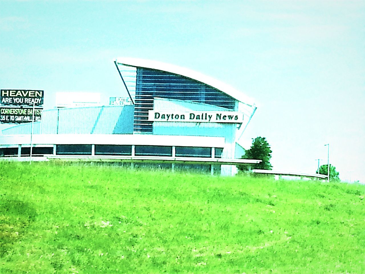 grass, architecture, built structure, building exterior, green color, clear sky, blue, grassy, field, copy space, day, sky, green, outdoors, no people, western script, lawn, grassland, sunlight, building