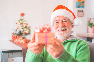 Portrait of woman holding christmas presents