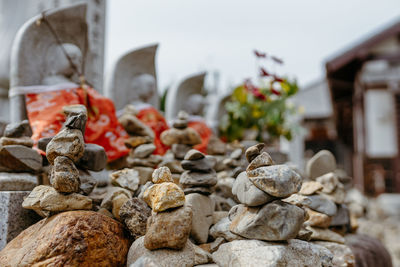 Close-up of buddha sculpture on rock