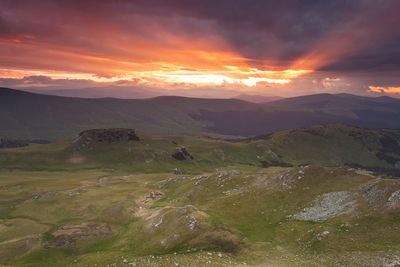 Scenic view of landscape against sky during sunset