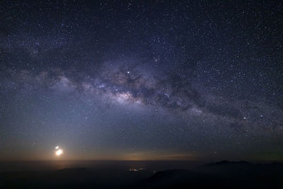 Scenic view of star field against sky at night