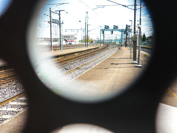 Train at railroad station platform against sky