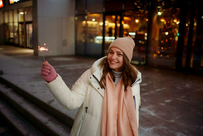 Caucasian white girl with sparklers christmas shopping