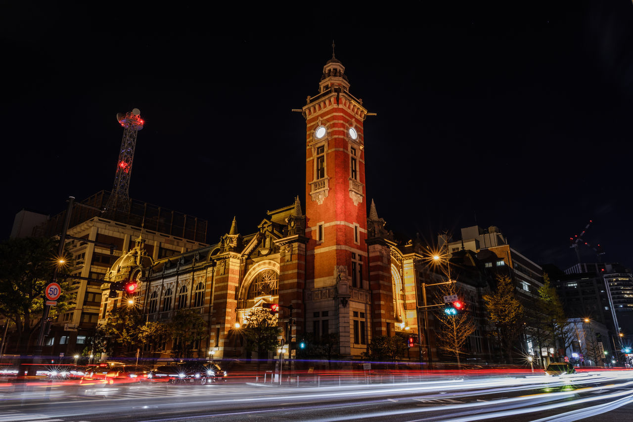 architecture, illuminated, built structure, building exterior, night, motion, city, long exposure, street, light trail, transportation, road, blurred motion, speed, travel destinations, tower, travel, building, tourism, no people