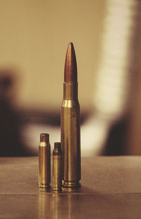 Close-up of bullets on table
