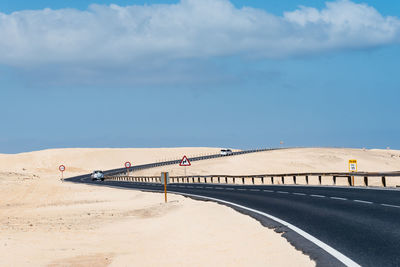 Bridge over sea against sky
