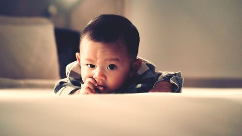 Portrait of cute baby at home