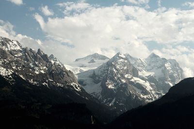 Scenic view of snow covered mountains against sky