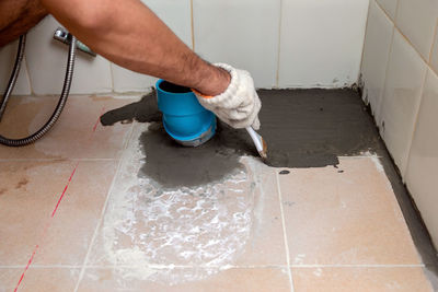 High angle view of person working on floor at home