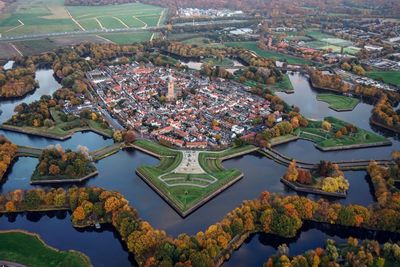 High angle view of lake amidst buildings in town