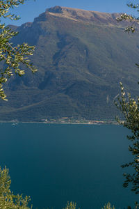 High angle view of lake and mountains against sky