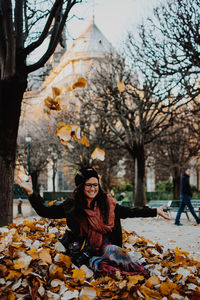 Portrait of smiling young woman during autumn