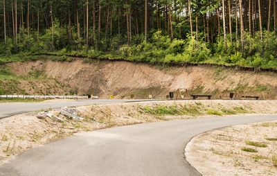 Paved road for summer training of biathletes at a training shooting range in the middle 
