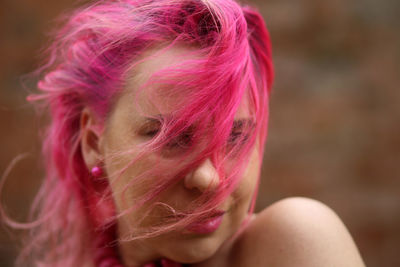 Portrait of woman with pink hair
