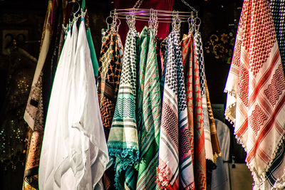 Multi colored flags hanging at market stall