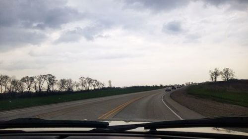 Road seen through car windshield