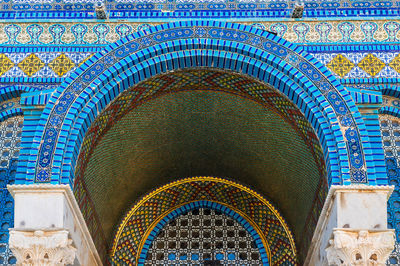 Low angle view of multi colored ceiling of building