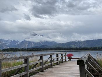 Bridge over lake against sky