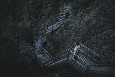 High angle view of person standing on staircase