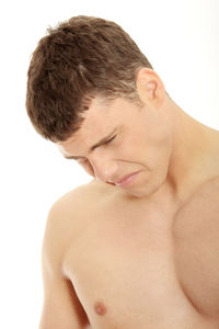 Close-up portrait of shirtless man