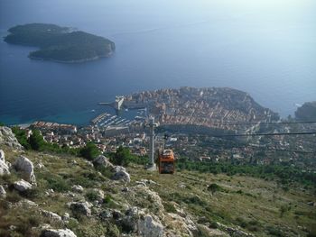 High angle view of townscape by sea