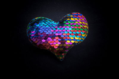 Close-up of heart shape decoration on black background