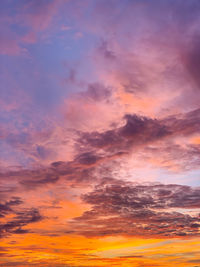 Low angle view of dramatic sky during sunset