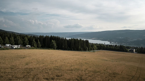 Scenic view of skandinavian landscape against mountain range
