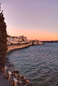 Scenic view of sea against clear sky during sunset