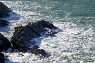 High angle view of rocks in sea